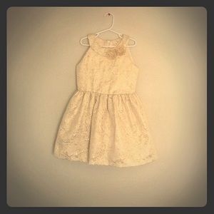 Child’s cream and gold floral print dress